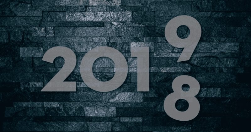 Dark blue stone background with numbers for year 2018 transitioning to 2019