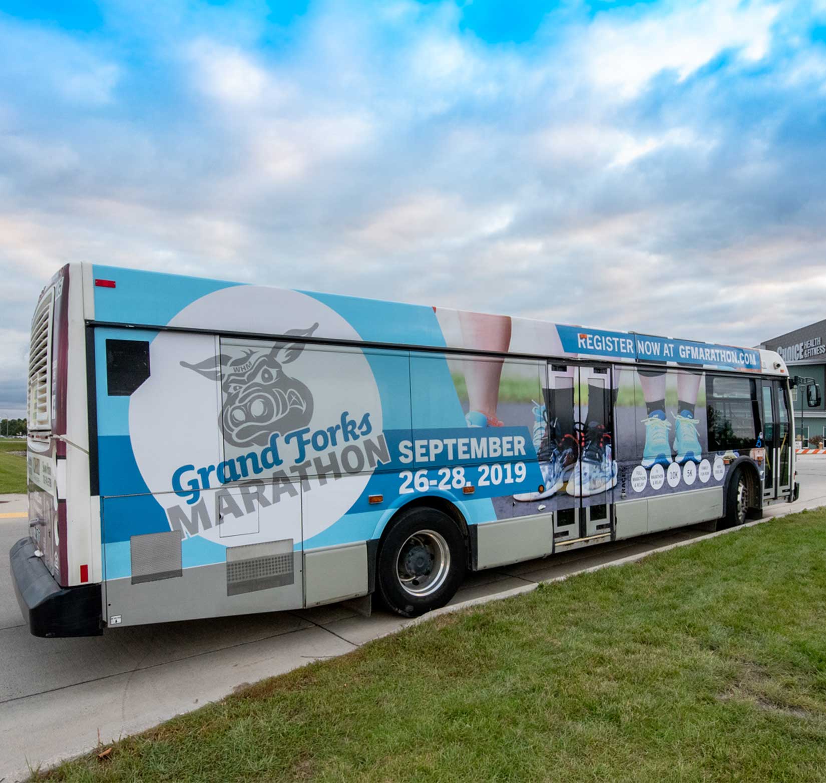 A bus wrap to promote the 2019 Grand Forks Marathon
