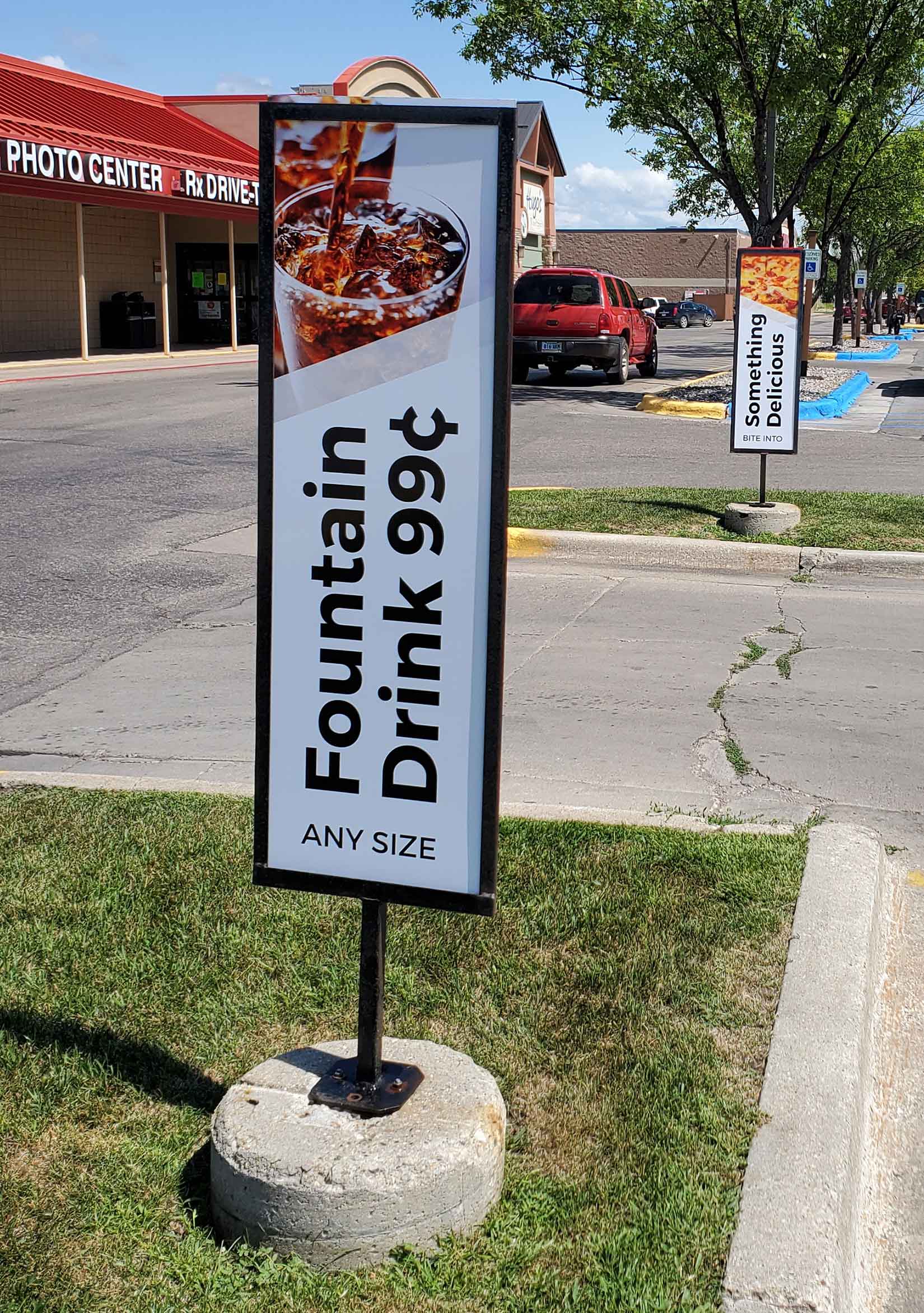 Vertical outdoor convenience store signs by Rogue Signs